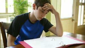 stock-footage-a-teenage-boy-struggling-with-his-homework